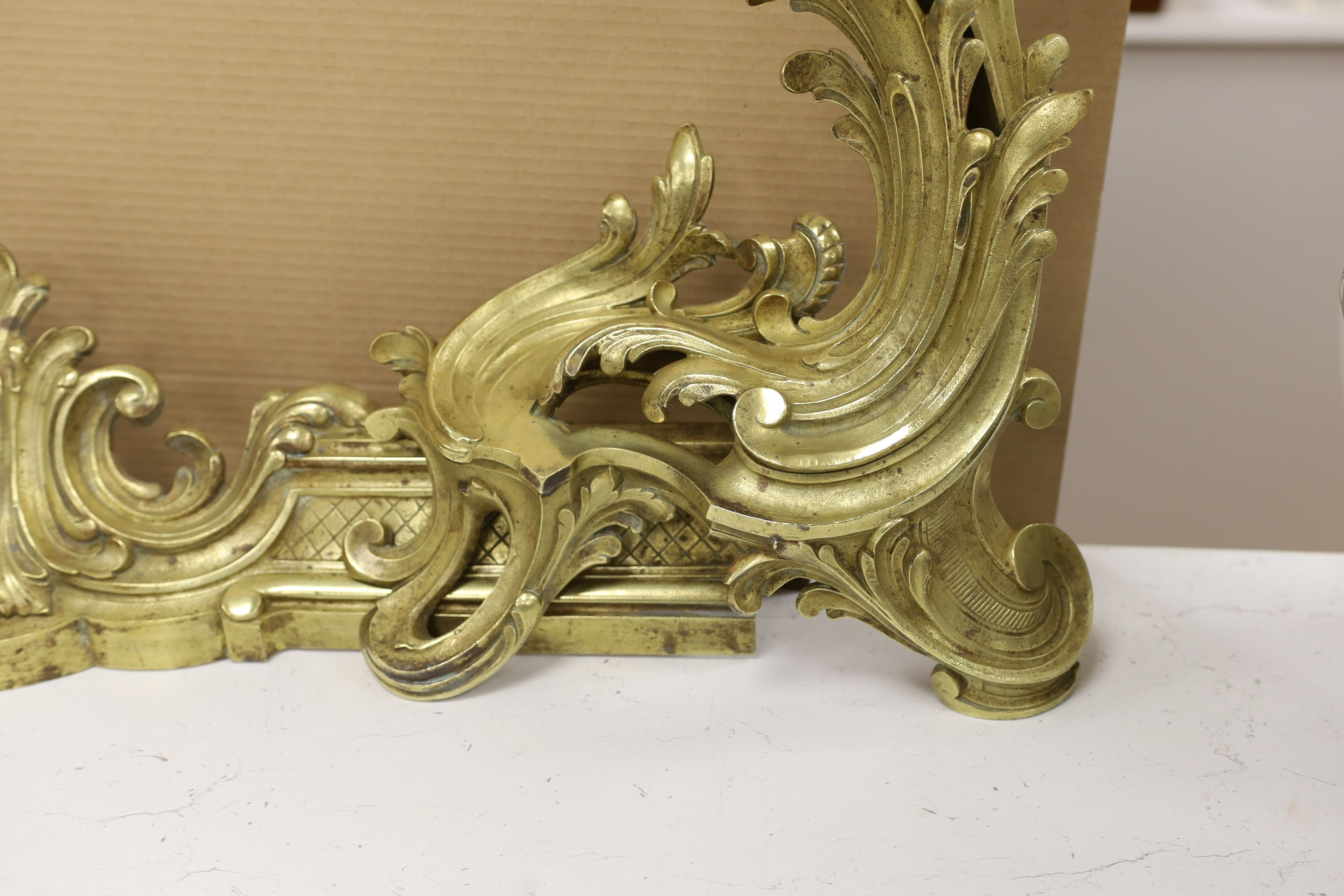 A French rococo style bronze adjustable chenet